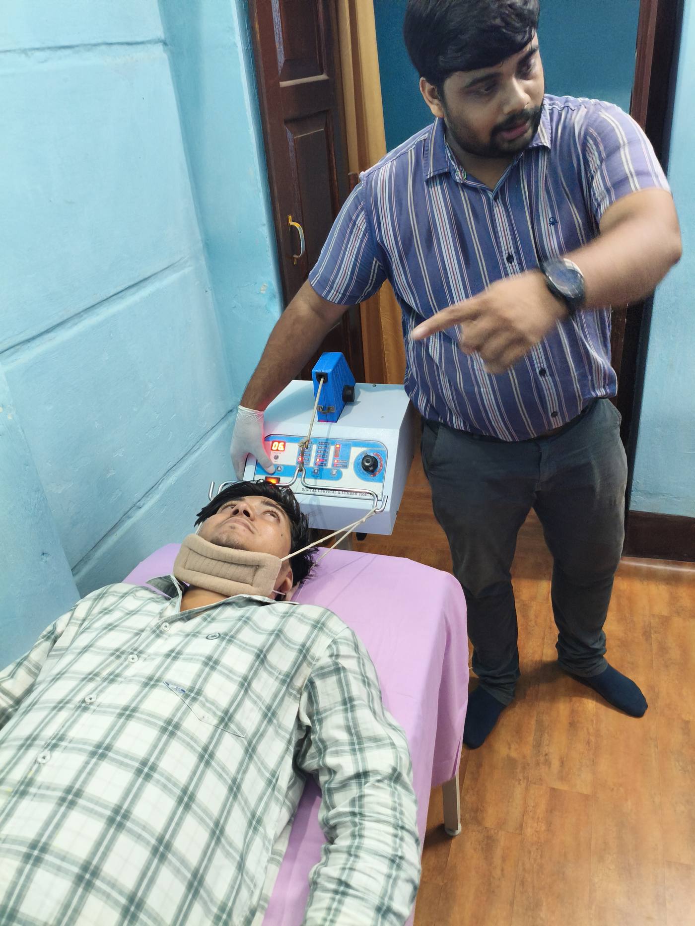 Doctor administering traction therapy